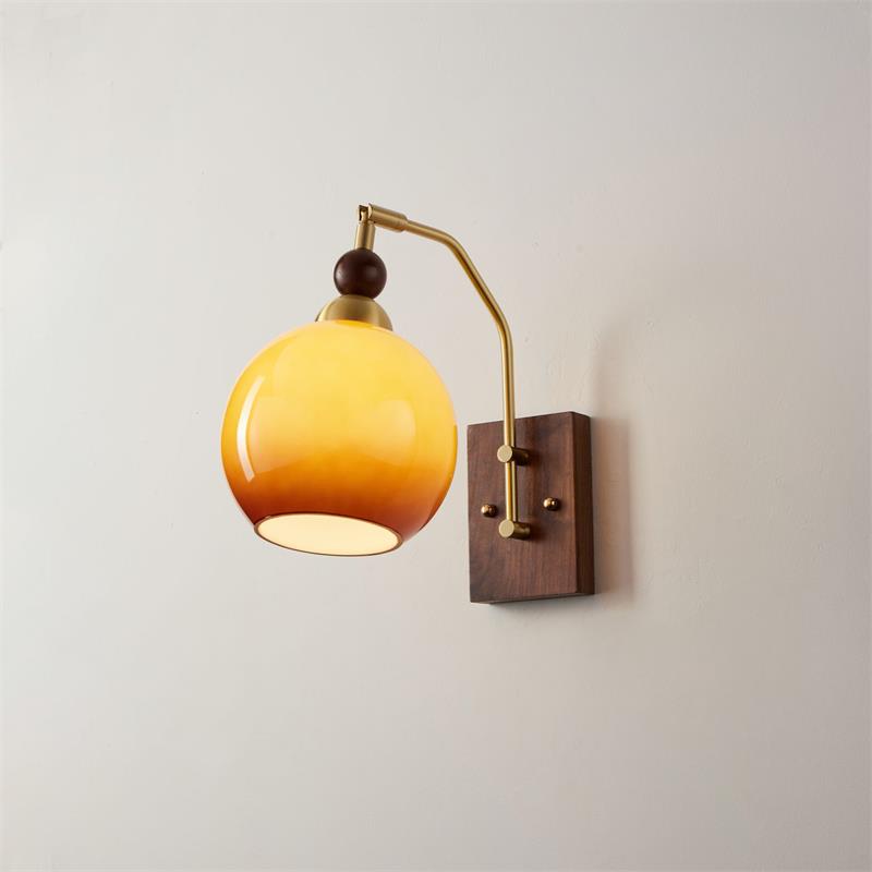 Elegant Wall Sconce Lighting with Caramel Glass Shade and Adjustable Arm for Modern Interiors