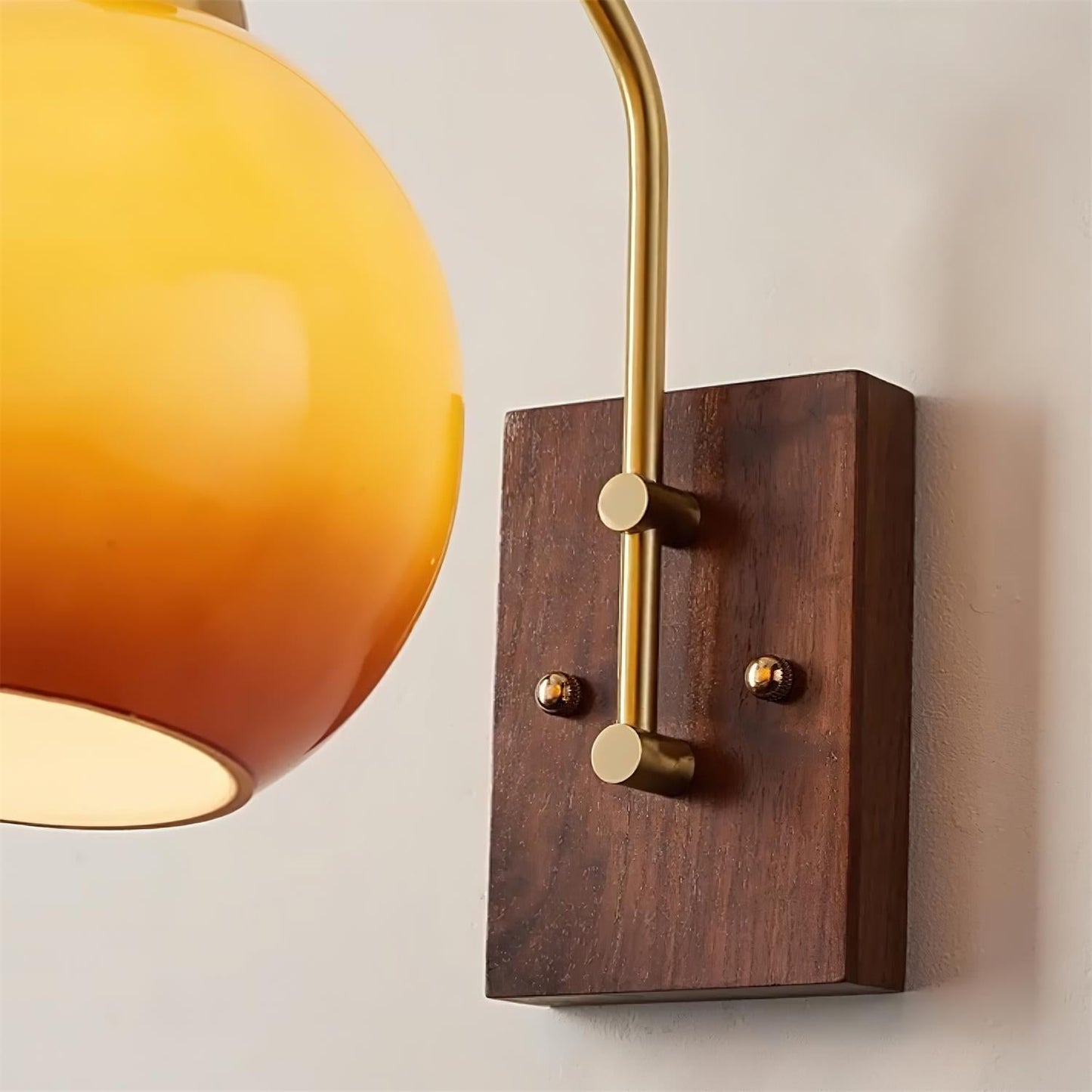 Elegant Wall Sconce Lighting with Caramel Glass Shade and Adjustable Arm for Modern Interiors