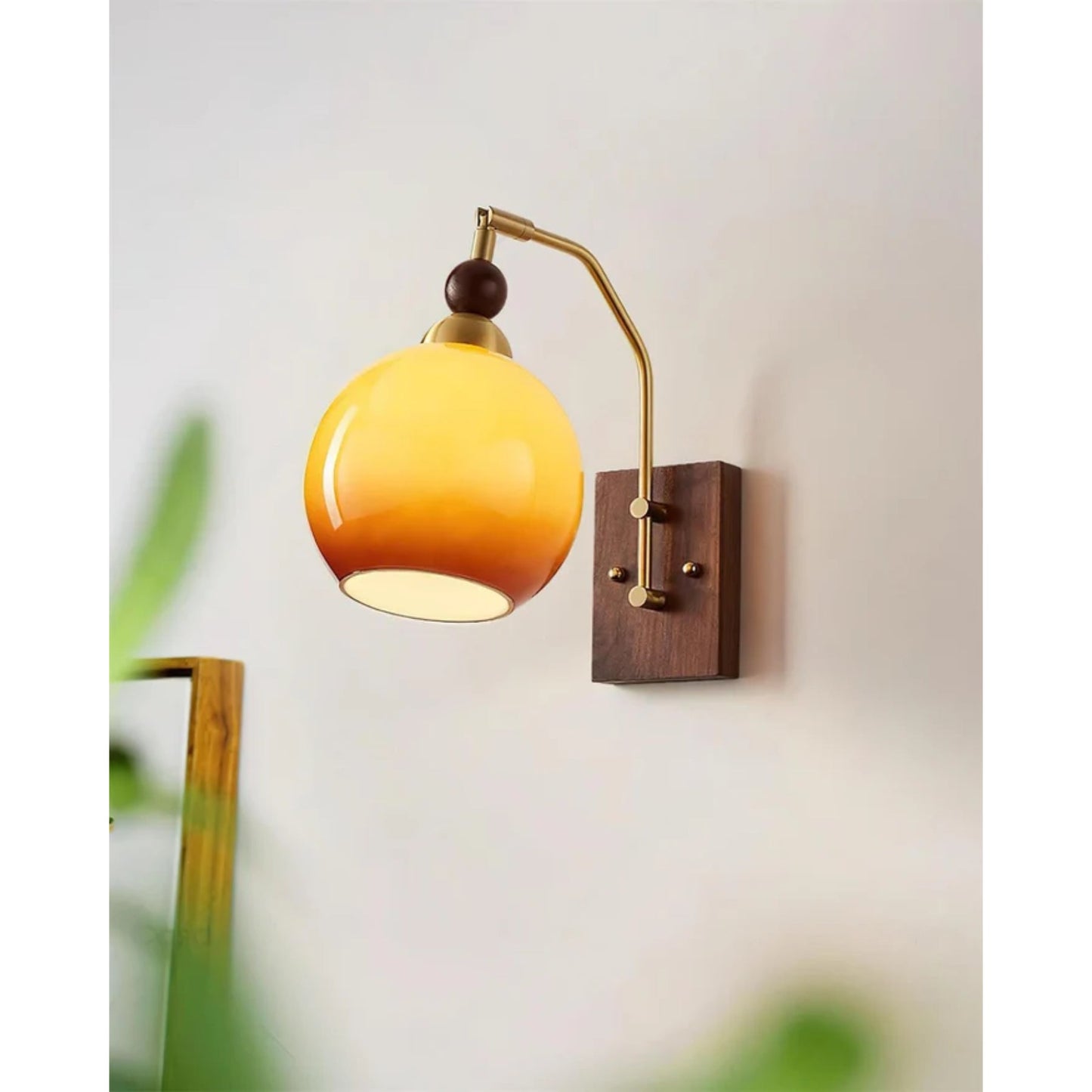 Elegant Wall Sconce Lighting with Caramel Glass Shade and Adjustable Arm for Modern Interiors