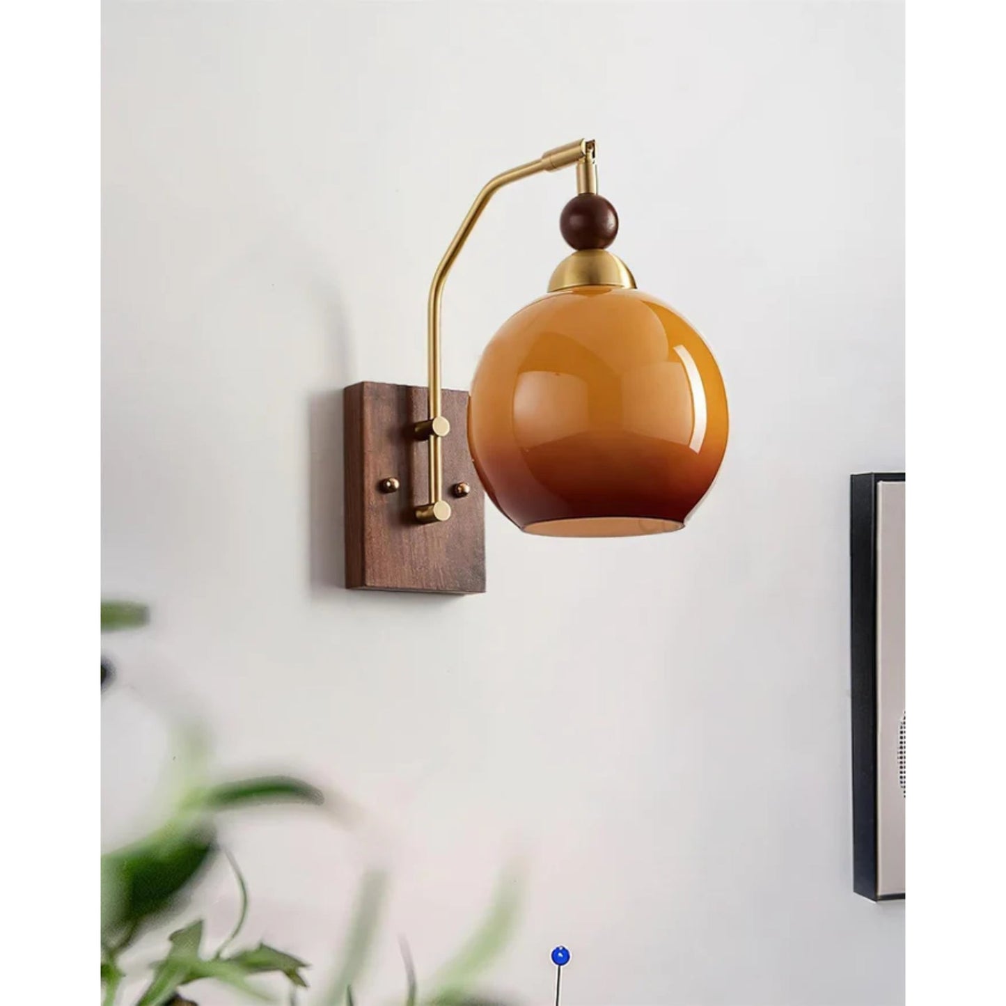 Elegant Wall Sconce Lighting with Caramel Glass Shade and Adjustable Arm for Modern Interiors